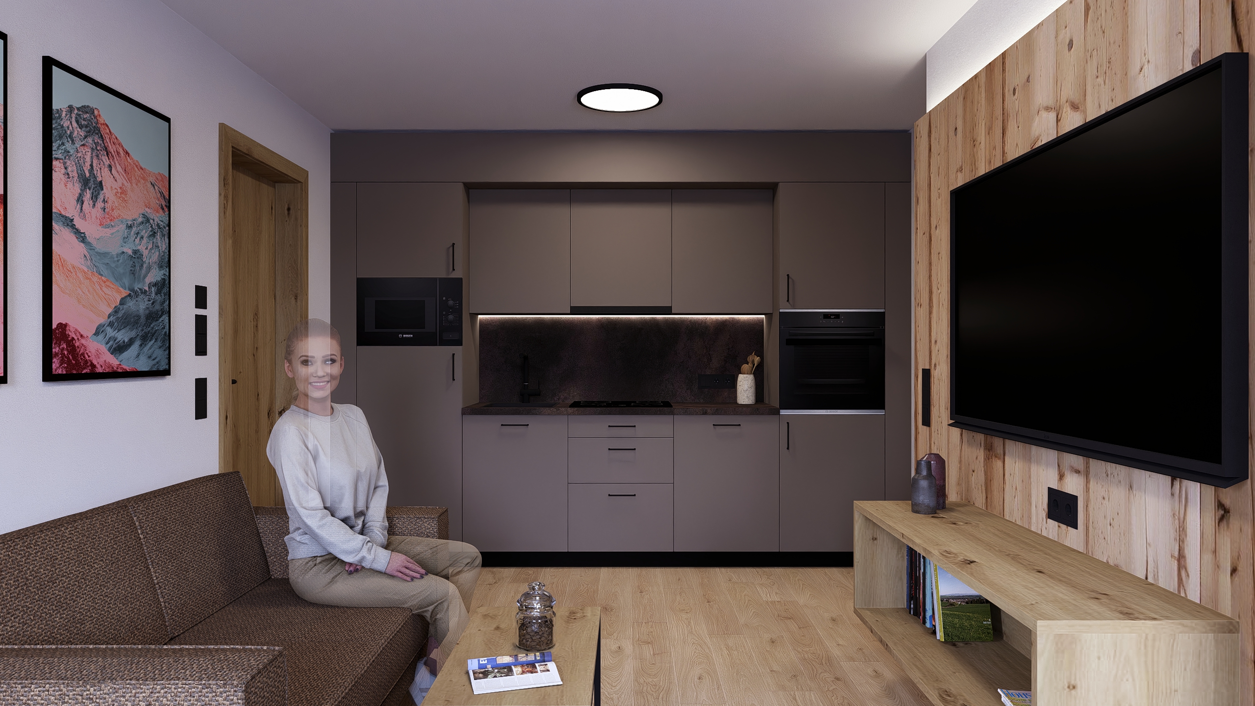 Wohnbereich der Ferienwohnung mit Sofa, TV und offener Küche